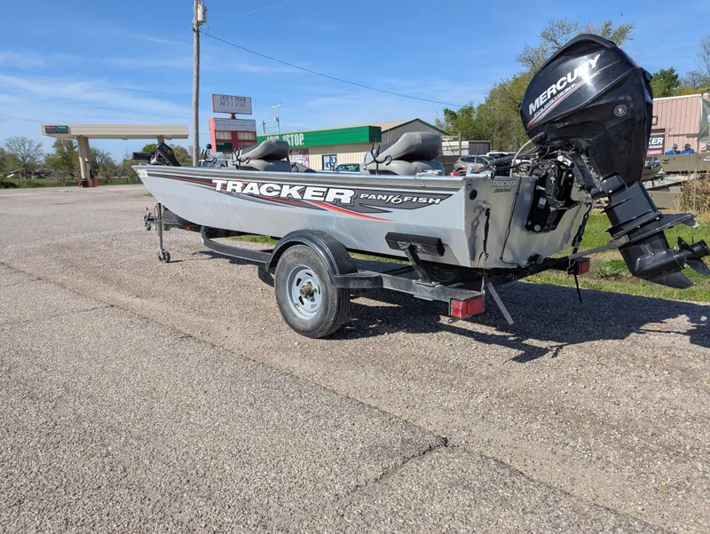 Slide: The Image of 2017 Tracker Panfish 16 boat with Mercury outboard motor on a trailer. - 3