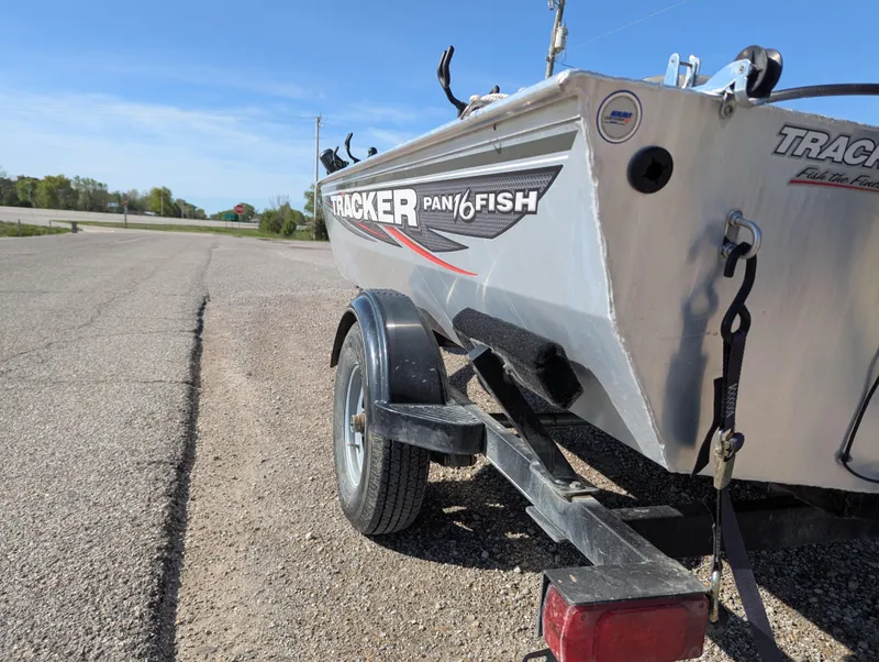 Slide: The Image of 2017 Tracker Panfish 16 boat on trailer, parked on a sunny day. - 4