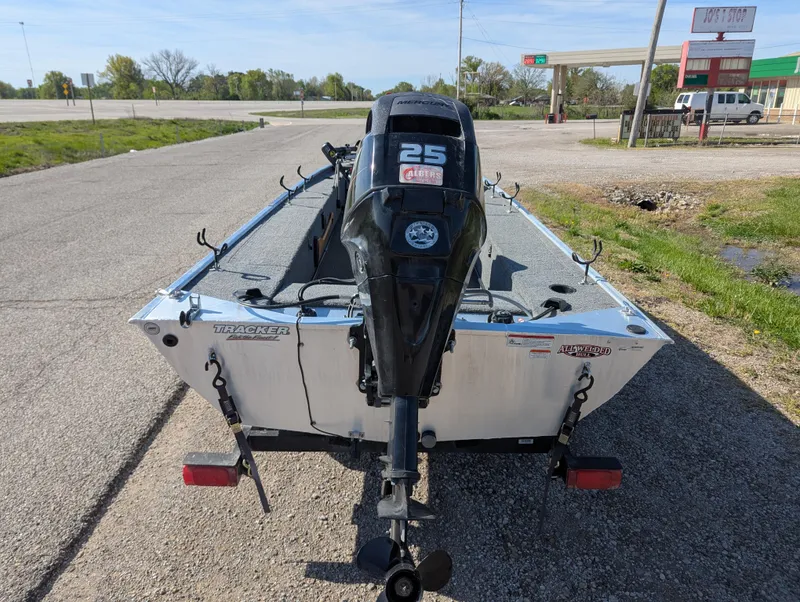 Slide: The Image of 2017 Tracker Panfish 16 boat with 25 HP motor on trailer, parked on roadside. - 5
