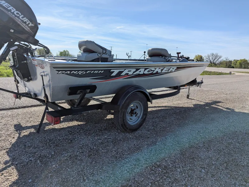 Slide: The Image of 2017 Tracker Panfish 16 boat on trailer, parked outdoors. - 7