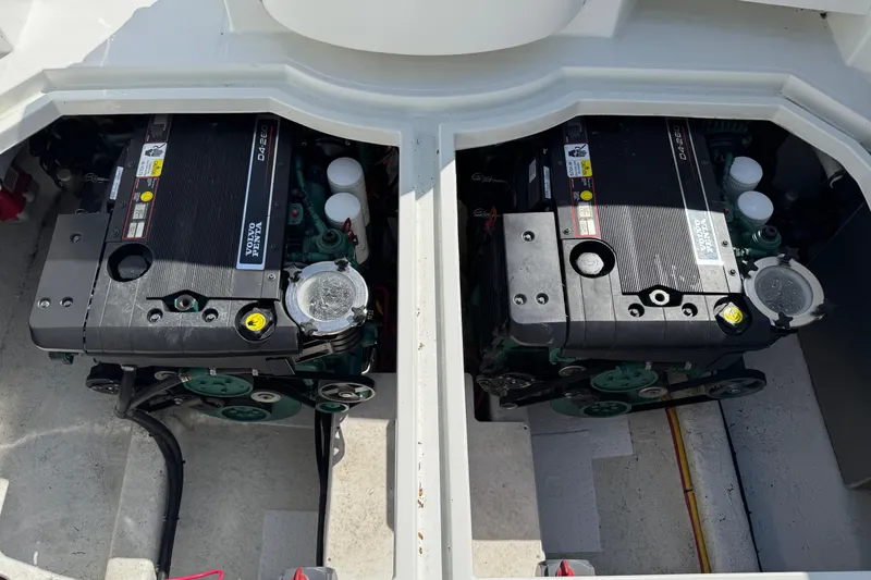 Slide: The Image of Twin engines in a 2010 Ocean Sport Roamer boat, showcasing powerful marine engineering. - 15