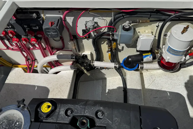 Slide: The Image of Engine compartment of a 2010 Ocean Sport Roamer with visible wiring and components. - 16