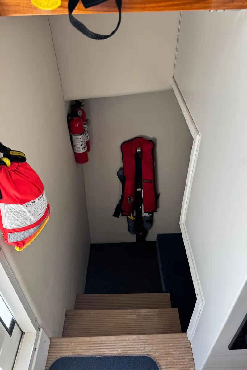 Slide: The Image of Stairway in 2010 Ocean Sport Roamer with life jacket and fire extinguisher. - 34