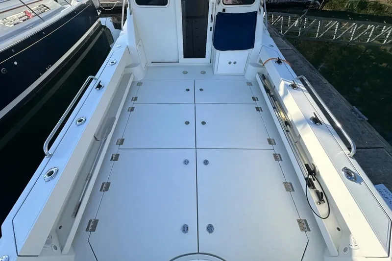 Slide: The Image of 2010 Ocean Sport Roamer boat deck with spacious layout and sleek design. - 41