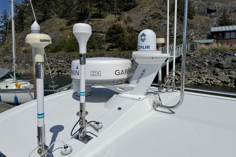 Slide: The Image of 2010 Ocean Sport Roamer boat with Garmin and FLIR navigation equipment on deck. - 5