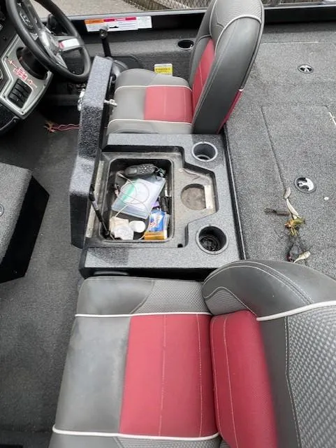 Slide: The Image of 2018 Ranger RT 198P boat interior with red and gray seats, center console storage. - 10