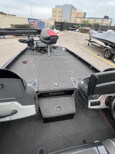 Slide: The Image of 2018 Ranger RT 198P fishing boat with spacious deck and modern controls. - 11