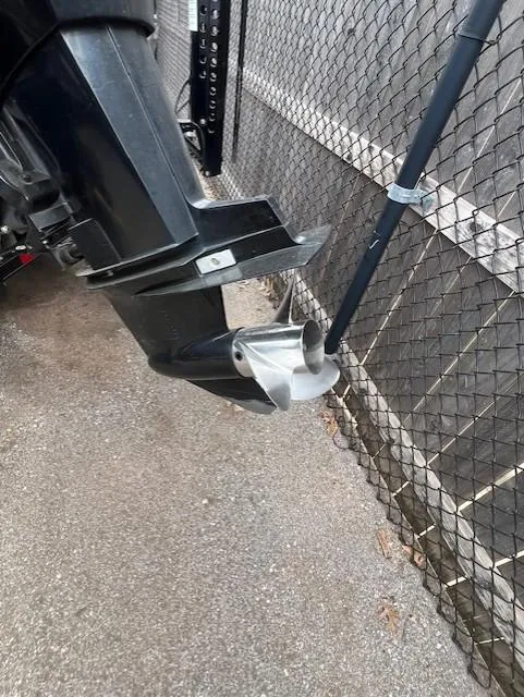 Slide: The Image of 2018 Ranger RT 198P boat motor and propeller near chain-link fence. - 12