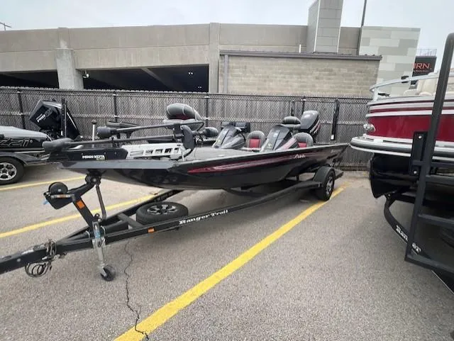 Slide: The Image of 2018 Ranger RT 198P boat on trailer in parking lot, side view. - 2