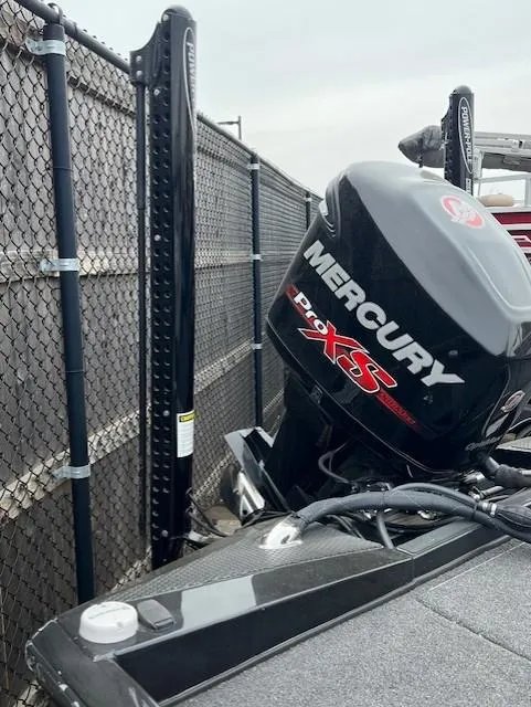 Slide: The Image of 2018 Ranger RT 198P boat with Mercury Pro XS engine near a chain-link fence. - 7