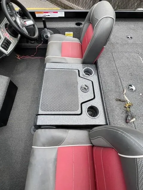 Slide: The Image of 2018 Ranger RT 198P boat interior with red and gray seats, steering wheel, and storage compartments. - 9