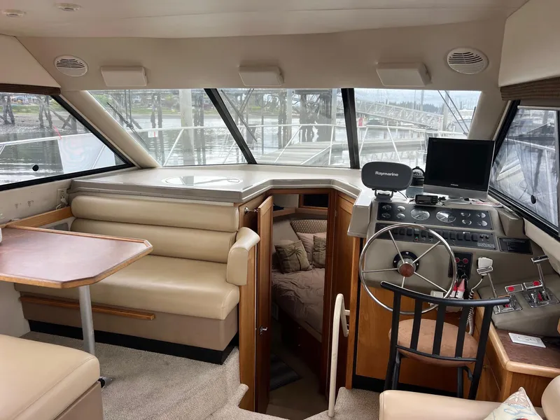 Slide: The Image of 1999 Bayliner 4087 Aft Cabin Motoryacht interior with helm, seating, and cabin view. - 14
