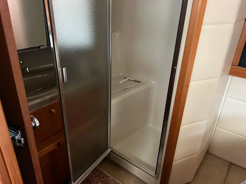 Slide: The Image of 1999 Bayliner 4087 Aft Cabin Motoryacht bathroom with shower and sink. - 19