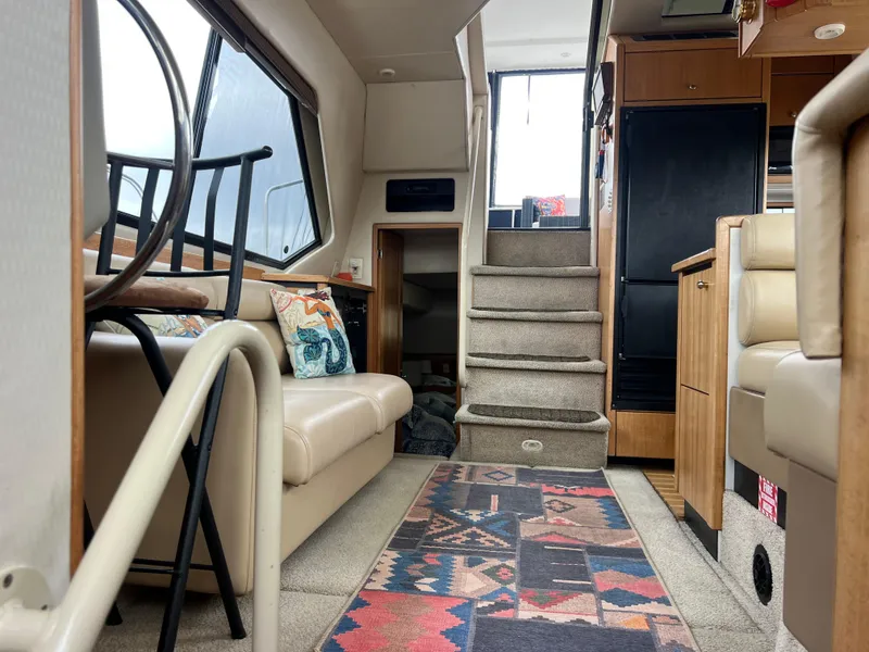 Slide: The Image of Interior of 1999 Bayliner 4087 Aft Cabin Motoryacht with stairs and seating area. - 26