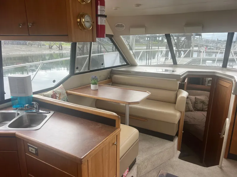 Slide: The Image of Interior of 1999 Bayliner 4087 Aft Cabin Motoryacht with dining area and kitchenette. - 35
