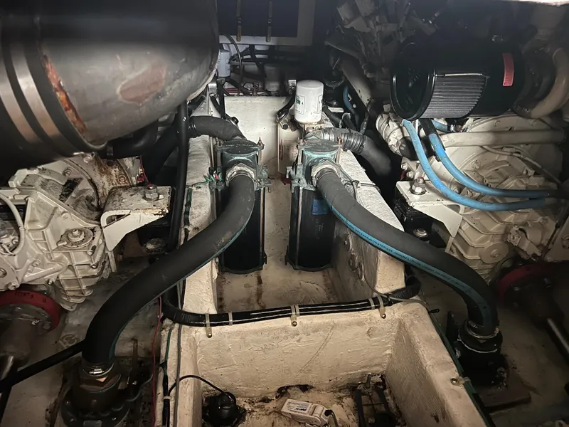 Slide: The Image of Engine room of 1999 Bayliner 4087 Aft Cabin Motoryacht, showcasing mechanical components. - 37