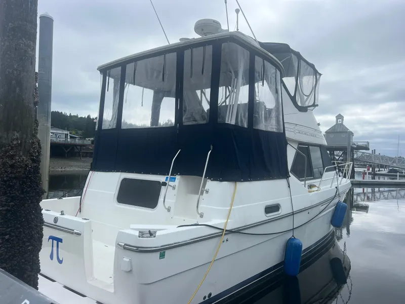 Slide: The Image of 1999 Bayliner 4087 Aft Cabin Motoryacht docked at marina under cloudy sky. - 39