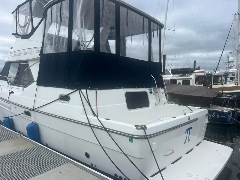 Slide: The Image of 1999 Bayliner 4087 Aft Cabin Motoryacht docked at marina under cloudy skies. - 41