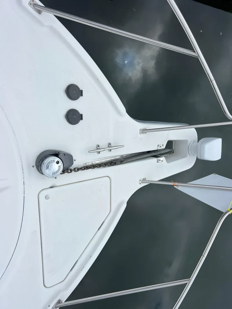 Slide: The Image of 1999 Bayliner 4087 Aft Cabin Motoryacht bow with anchor and chain on calm water. - 5