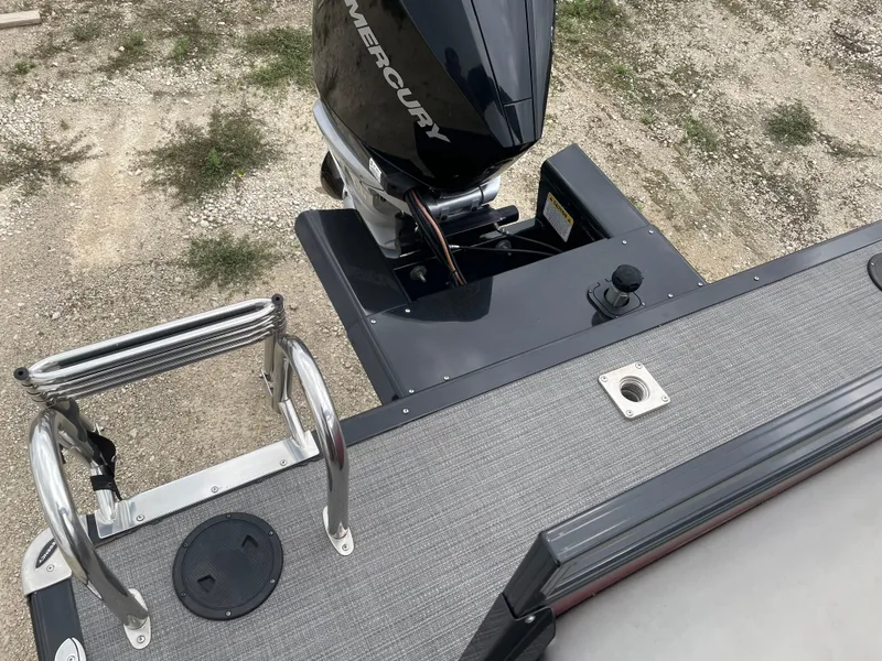 Slide: The Image of 2022 Regency 250 DL3 boat with Mercury outboard motor and swim ladder. - 17