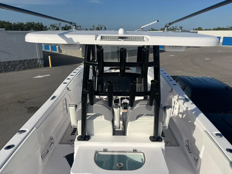 Slide: The Image of 2025 Twin Vee 280 GFX2 CC boat, center console, sleek design, white and black accents. - 10