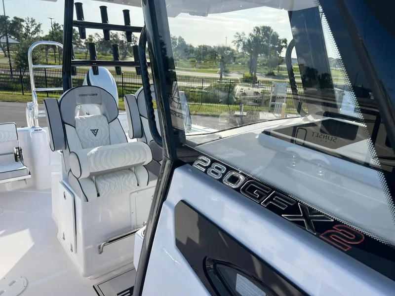 Slide: The Image of 2025 Twin Vee 280 GFX2 CC boat interior with sleek seating and modern design. - 7