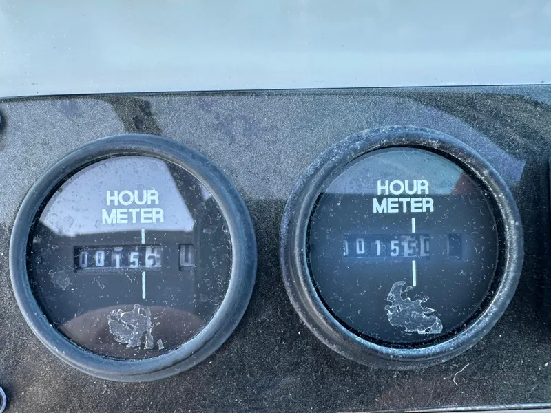 Slide: The Image of Hour meters on 2004 Cruisers Express, both displaying 1750 hours. - 17