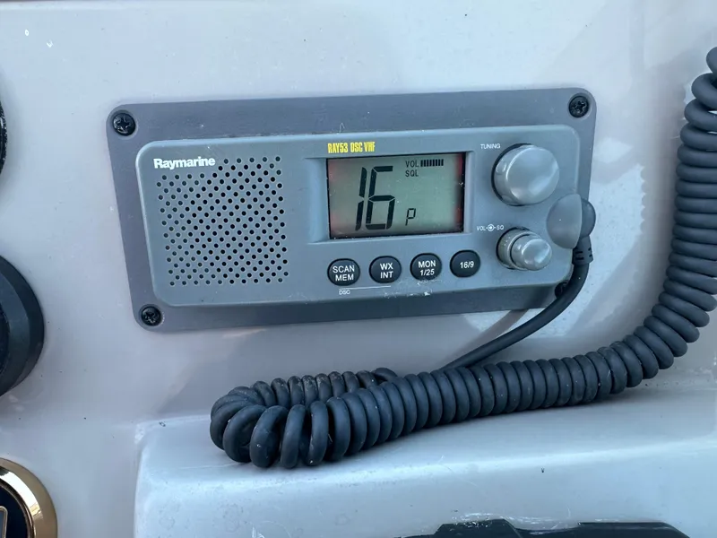 Slide: The Image of VHF marine radio on 2004 Cruisers Express boat dashboard. - 18