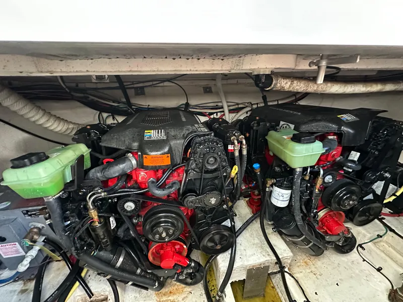 Slide: The Image of 2004 Cruisers Express engine compartment with dual engines and visible components. - 31