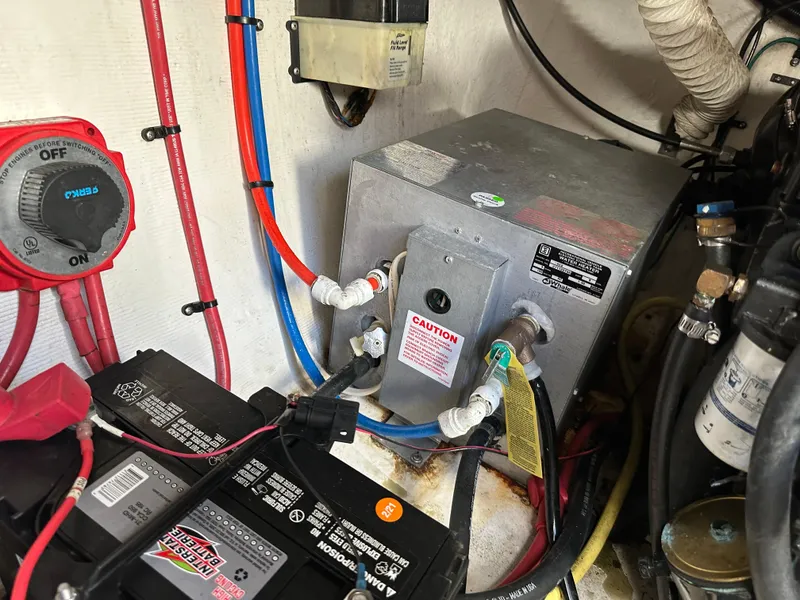 Slide: The Image of Electrical system of a 2004 Cruisers Express boat, featuring batteries and wiring. - 33