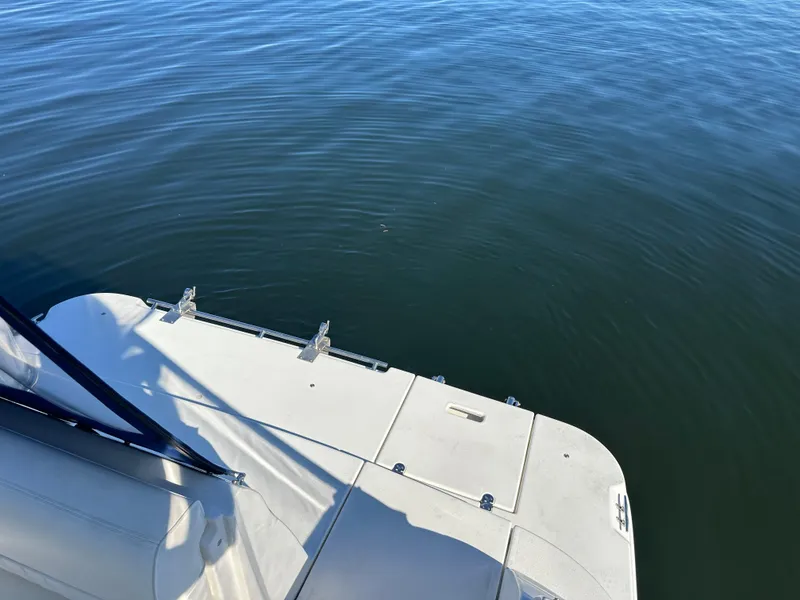 Slide: The Image of 2004 Cruisers Express boat deck overlooking calm water. - 4