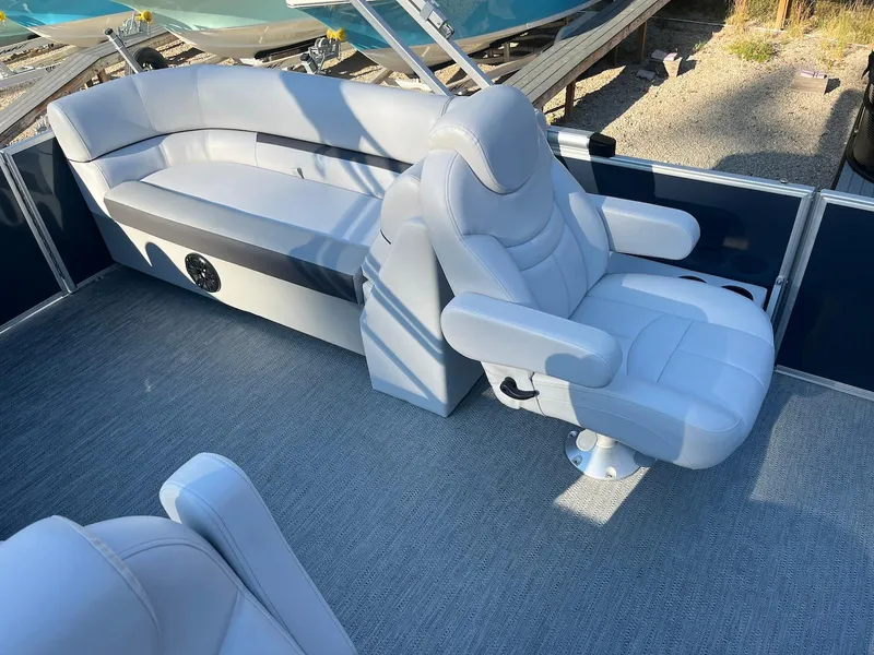 Slide: The Image of 2024 Godfrey SWEETWATER 2286 SB boat interior with plush seating and modern design. - 13