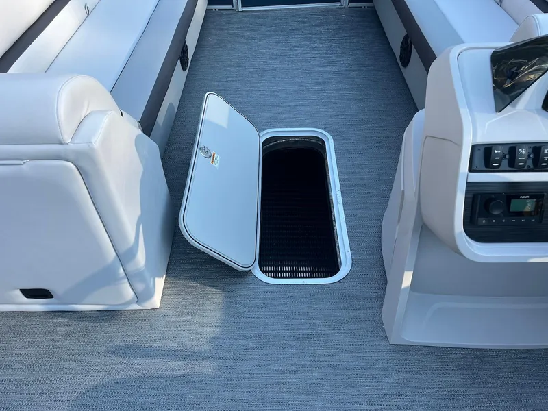 Slide: The Image of 2024 Godfrey SWEETWATER 2286 SB interior with open storage compartment on deck. - 8