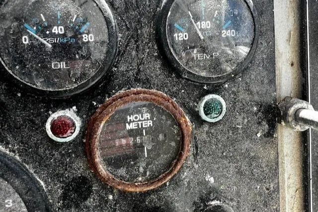 Slide: The Image of Dashboard of a 1990 Downeast Beal Lobster Boat with hour meter. - 10