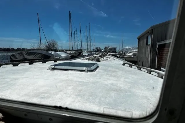 Slide: The Image of 1990 Downeast Beal Lobster Boat in harbor, blue sky. - 12