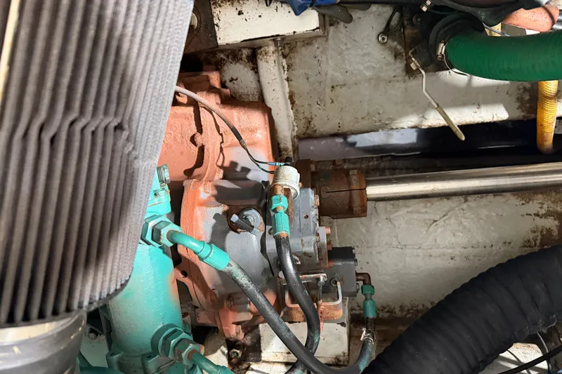 Slide: The Image of Engine compartment of a 1990 BEALS Lobster Boat/Fishing Commercial vessel, showing mechanical components. - 17