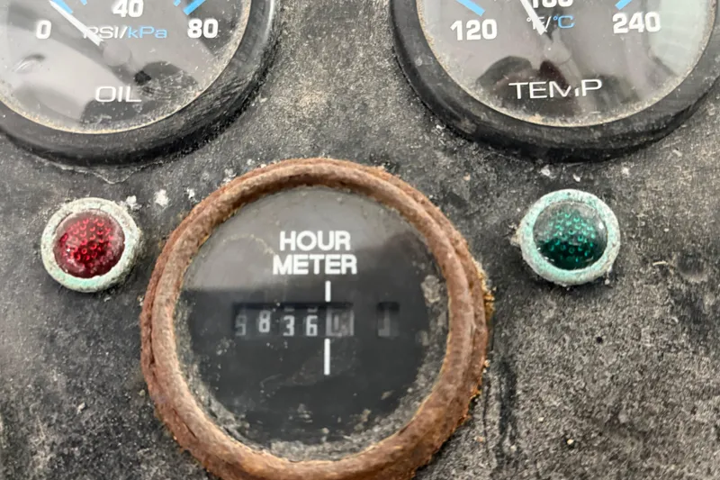 Slide: The Image of Close-up of a 1990 BEALS Lobster Boat hour meter and gauges. - 18