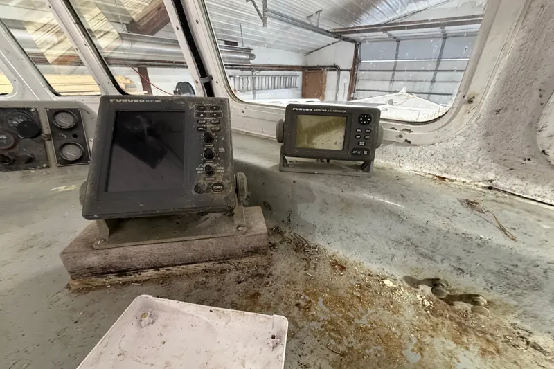 Slide: The Image of Interior of a 1990 BEALS Lobster Boat with navigation equipment. - 19