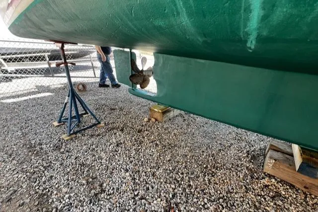Slide: The Image of Underside of a 1990 Downeast Beal Lobster Boat on gravel. - 21