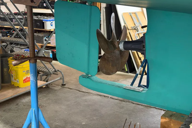 Slide: The Image of Propeller and rudder of a 1990 BEALS Lobster Boat in a workshop setting. - 23
