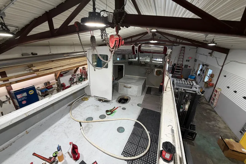 Slide: The Image of Interior of a 1990 BEALS Lobster Boat in a workshop setting. - 6