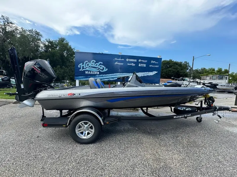 The Image of 2025 Ranger Z185 boat on trailer at outdoor dealership, clear sky background. - 0