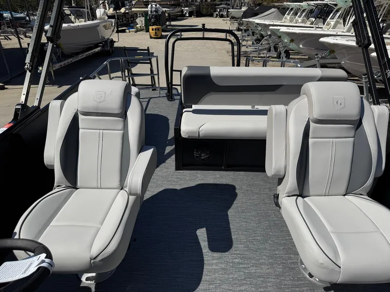 Slide: The Image of 2025 Godfrey Sweetwater 2286 SFLC boat interior with plush seating and modern design. - 10