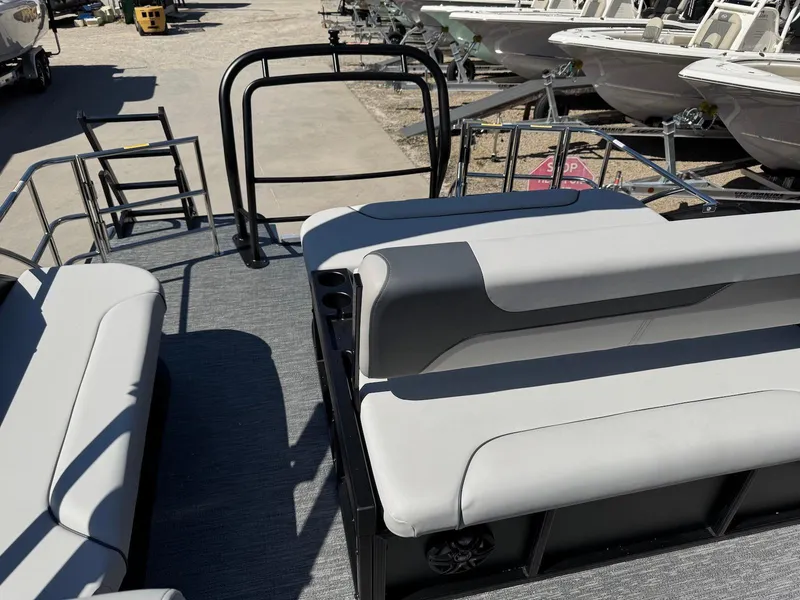 Slide: The Image of 2025 Godfrey Sweetwater 2286 SFLC pontoon boat interior with gray seating and railing. - 11