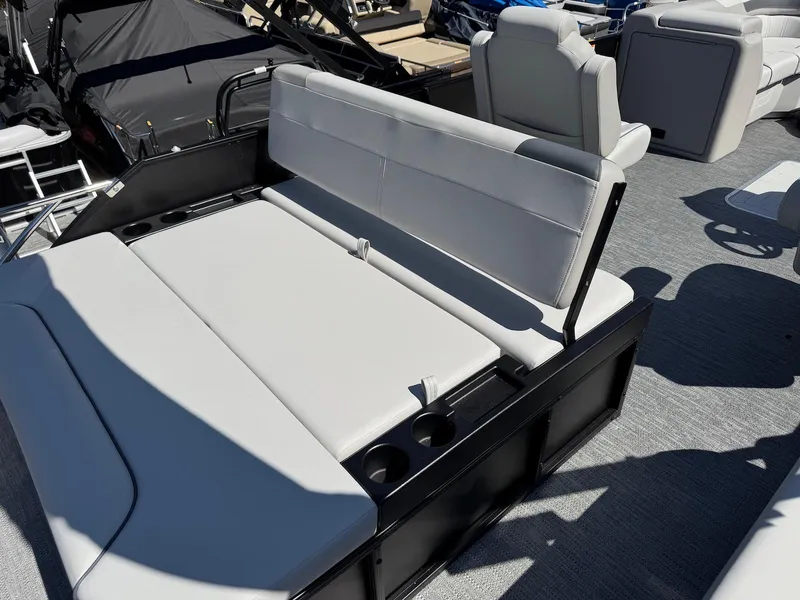 Slide: The Image of 2025 Godfrey Sweetwater 2286 SFLC boat interior with gray seating and cup holders. - 12