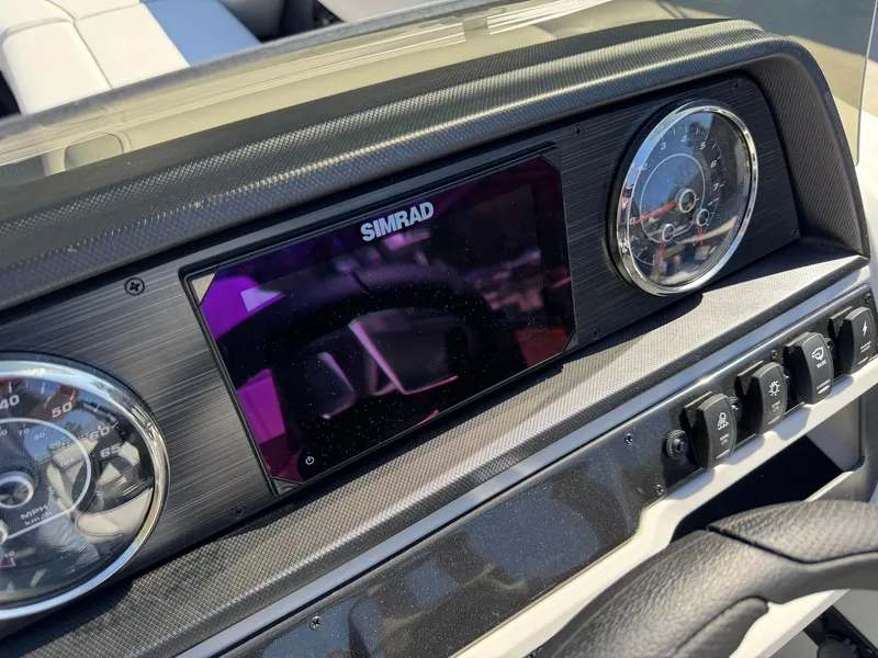 Slide: The Image of Dashboard of 2025 Godfrey Sweetwater 2286 SFLC with Simrad display and gauges. - 15