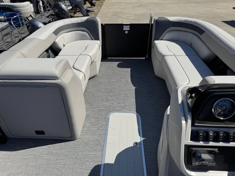 Slide: The Image of 2025 Godfrey Sweetwater 2286 SFLC pontoon boat interior with plush seating and modern dashboard. - 18