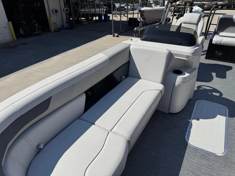 Slide: The Image of 2025 Godfrey Sweetwater 2286 SFLC boat interior with sleek seating and modern design. - 9