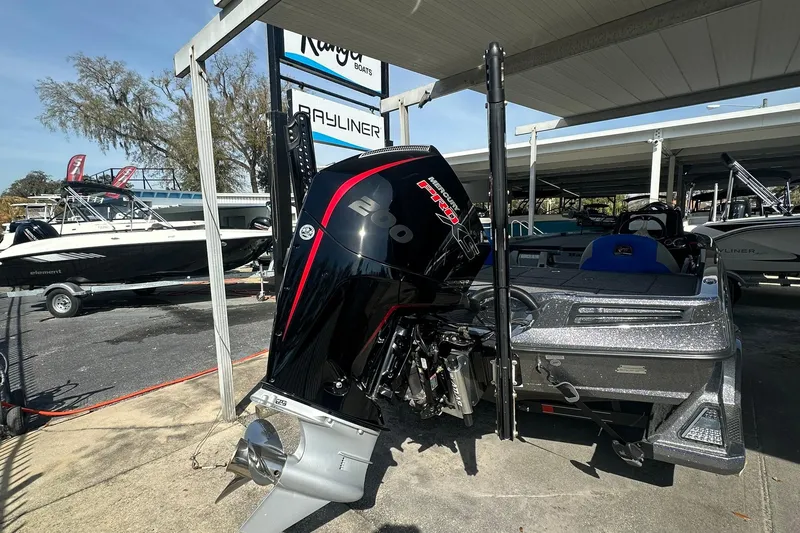 Slide: The Image of 2025 Ranger Z185 boat with powerful Mercury Pro XS engine displayed at dealership. - 104