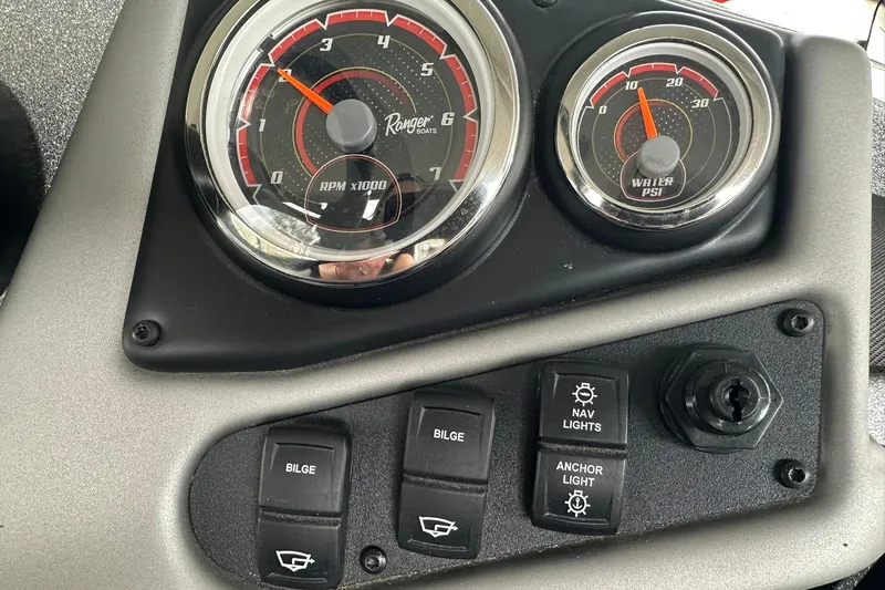 Slide: The Image of Dashboard of 2025 Ranger Z185 boat with RPM and water PSI gauges. - 115